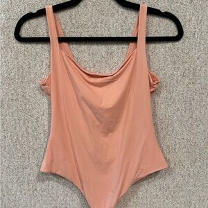 SKIMS Peach Scoop Neck One-Piece Thong Bodysuit, size Large. NWOT.
